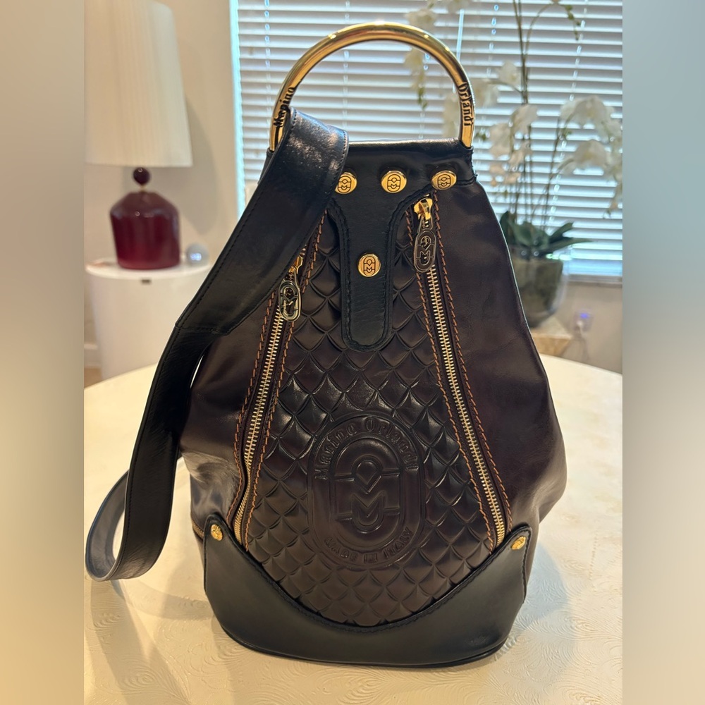 Marino Orlandi Backpack
Brand New -brown with gold hardware